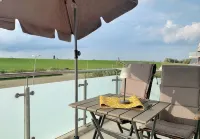 Modern vacation apartment directly on the North Sea dike