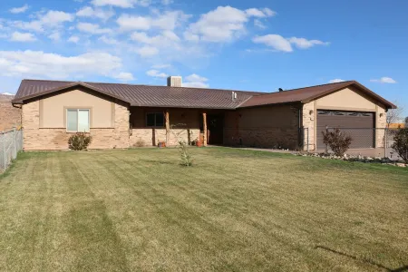 Quiet neighborhood home with mountain and red rock views
