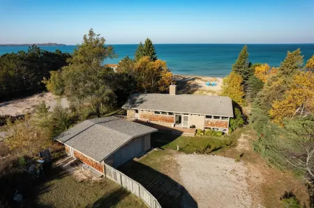 Midcentury home, private beach, large deck with dining