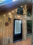Secluded creekside treehouse cabin in Shelby with hot tub, AC, WiFi
