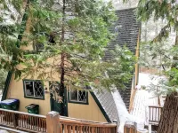 Private cabin in a small mountain town surrounded by pine trees. Snow getaway