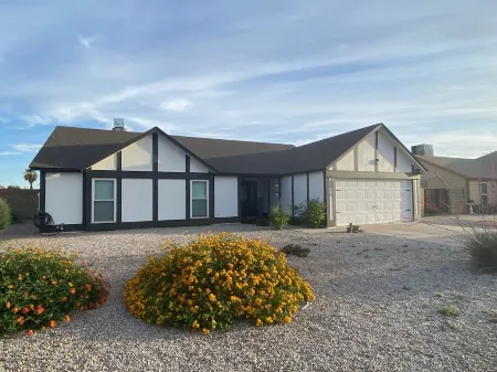 4 BR, 2 BA home with heated pool located near shopping, dining & entertainment