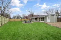 Dog-friendly home with a firepit, yard, washer/dryer, central AC & game room
