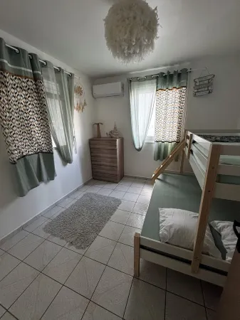 Comfortable family home between waterfalls and heavenly beaches