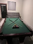 The place to stay: pool table, king bed.