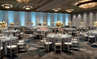 a large banquet hall with multiple tables and chairs set up for a formal event at Bethesda North Marriott Hotel & Conference Center