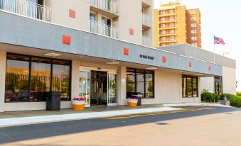 "a building with a sign that reads "" the mann bakery "" on the front , indicating its location" at Silver Beach Hotel