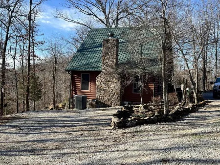 Log cabin on 9 acres. Perfect for a winter retreat or summer trip to the river.