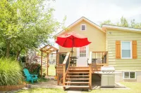 Cozy little house blocks from the Park & Fair Grounds.  EV Charger equipped.