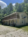 Beautiful 4 unit lodge w/ Hot tub, WiFi, fire pits &  pavilion area with grills
