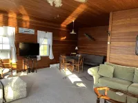 Sunny cottage built over the water on the St. Lawrence River