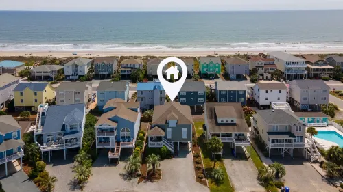 4BR beach getaway steps away from the beach with community pool