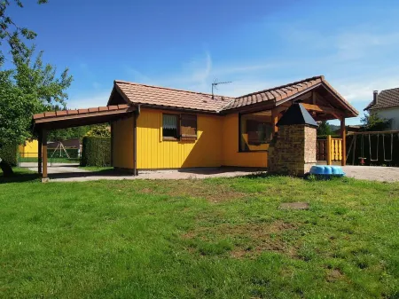 Fenced cottage rental with barbecue and children's play area