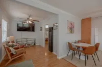 Across quiet street from sandy beach.