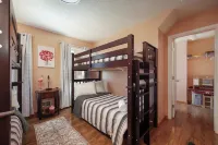 Spacious 6-bedroom Pocono Home with Hot Tub, Game and Theater rooms, Fire Pit!