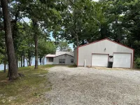 Updated 3 bedroom lakefront home offers privacy and comfort w dock on Grand Lake