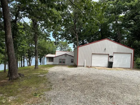 Updated 3 bedroom lakefront home offers privacy and comfort w dock on Grand Lake