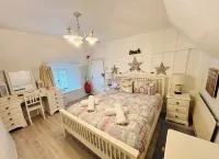 Charming  Listed Thatched Cottage with parking and short walk to sandy beach .