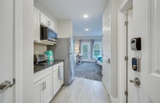 No Cleaning Fee! Brand New Double Queen Studio Condo w/ Waterfront Pool + Beach