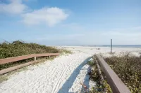Steps from the pool and ocean! Four-level East Beach townhome with elevator!
