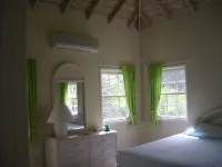 Villa with large pool, screened terrace overlooking Caribbean.