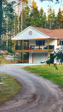 Experience panoramic views in ur 5-bed Frankfort retreat minute to Lake Michigan