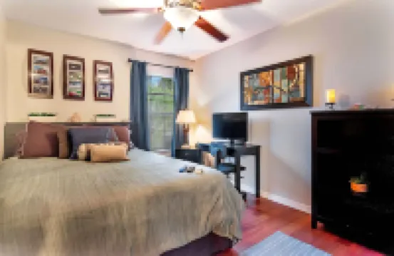 Urban Oasis W/Hot Tub, Heated Pool and Private Movie Theater 2 Bedroom Home by RedAwning