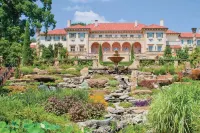 Spacious Fenced Backyard and Fire Pit - Inviting Tranquil Retreat Hotels near Tulsa International Airport