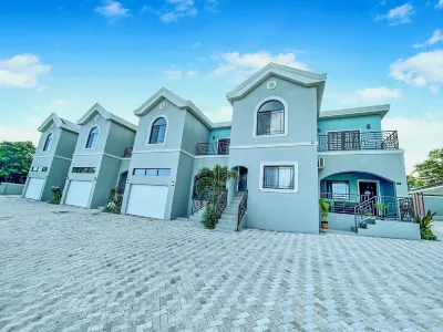 Stylishly Modern Apt° in Upscale Area ~with Private Beach & Pool Access Hotels in 