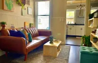 Step into a serene stay where electric charm meets cozy coastal tranquility.