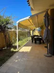 Three-room apartment with private garden 200 meters from Punta Tegge beach