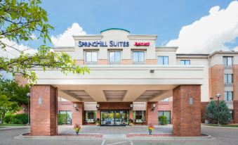 the exterior of the springhill suites by marriott hotel with its entrance and parking lot at SpringHill Suites Minneapolis Eden Prairie