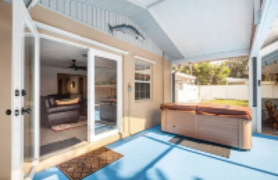 Home with play room, enclosed pool and hot tub. Only 10 minutes from the beach!