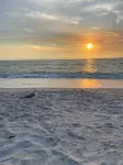 Welcome to White Sands Getaway just 50 steps to a beach Paradise! Sunset views!