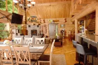 Beautiful log cabin in the woods with a hot tub. 5 min walk to a quiet beach. Hotels in Chippewa County
