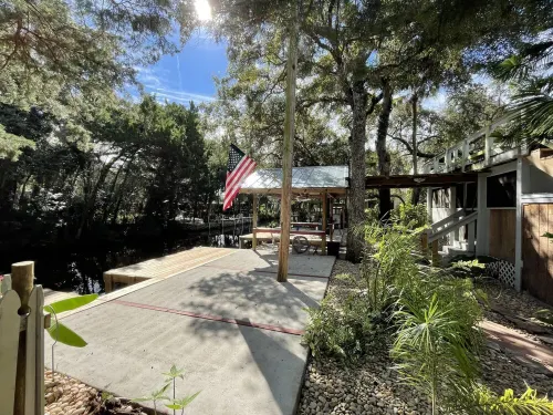 Waterfront Retreat with fenced yard, porch + bar, canal views, NEW DOCK