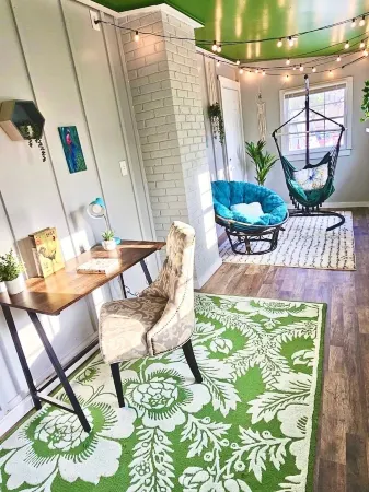 Updated 4-bedroom house with relaxing sunroom; minutes from downtown Raleigh.