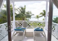 Stunning waterfront property with panoramic sunset views + pool + dock