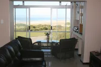 Beach Front Apartment close to the beach with magnificent sea views. Hotels in Aston Bay