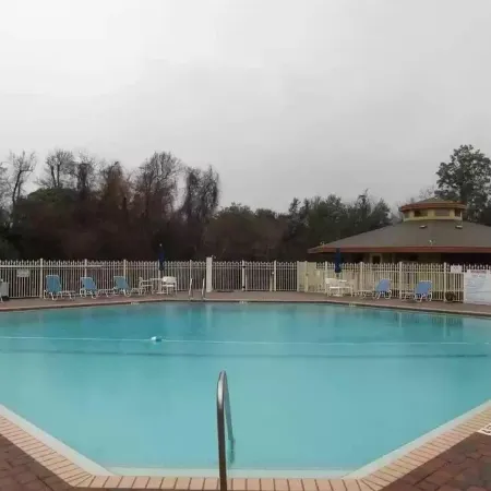 Family Friendly Condo minutes to beach w/ large pool and private outdoor space.