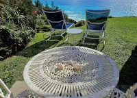 Sand Pebble 1 Bdrm Apt on Marley Beach w/ ocean views & steps to private beach