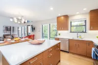 Hidden Gem, 4 Min to Lift 7 Garage, Hot Tub, Lux Kitchen, Big + Bright 4 Bedroom Condo by RedAwning