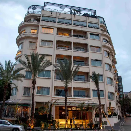 Warwick Palm Beach Hotel Отели рядом с достопримечательностью «Залив Зайтуна»