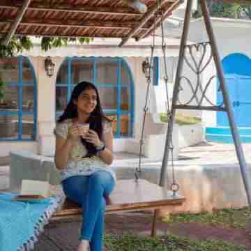 StayVista's Casa Blanca - Modern Elegance with a Pool, Spacious Lawn & Diverse Activities Rooms