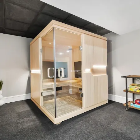 High-end home w/ fireplace, gourmet kitchen, sauna, game rm/ large yard/fire pit