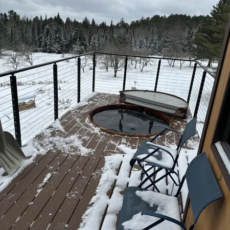 Enjoy whatever winter throws at you while you relax in the hot tub with a view!