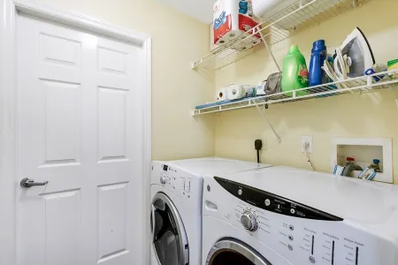 Fenced, private, family friendly villa with exotic poolside views near airport.