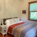Bright art-filled home, fruit trees, valley view