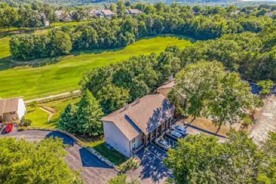 All-season retreat on golf course with indoor/outdoor pools, hot tub, central AC