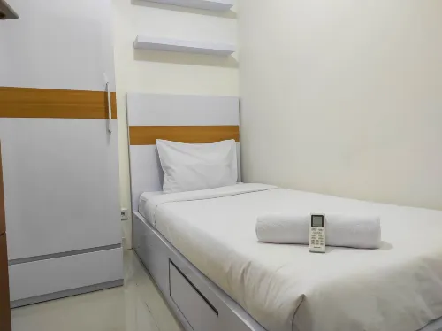 Homey and Comfy 2Br at Vida View Apartment Hotels in Panakkukang